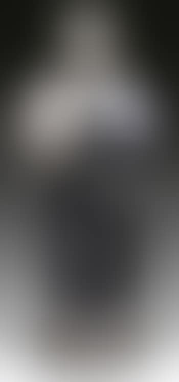 A standing figure in ceremonial pose with palms touched together and eyes closed (preview)