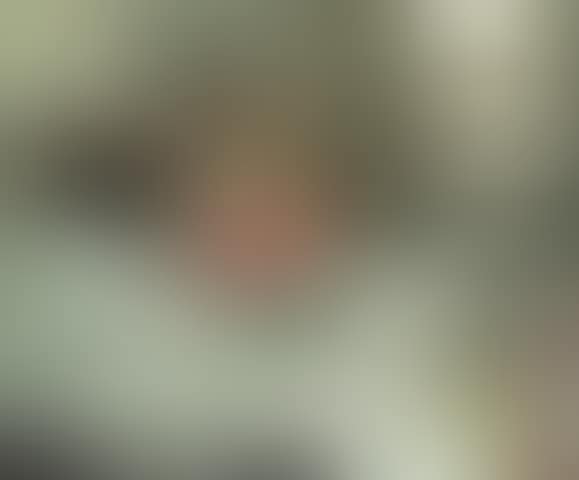 Lady seated on a bed (preview)