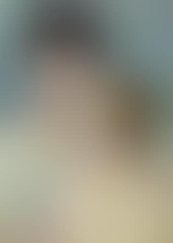Mother looking down at her blond baby boy (preview)