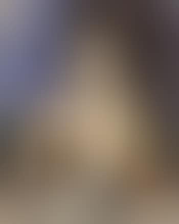 Girl seated at a table (preview)