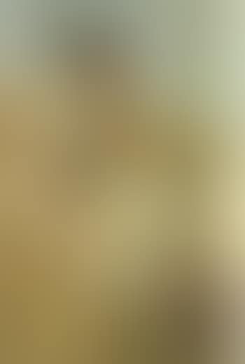 Girl seated wearing green head scarf (preview)