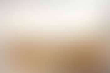 Lone figure in a cornfield overlooking a valley (preview)