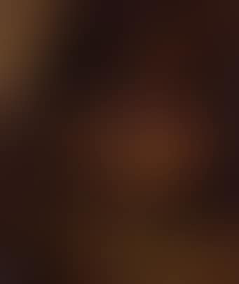 Peasant couple at spinning wheel by fire in barn (preview)