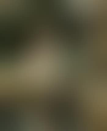 Young lady sitting on rug by pond (preview)