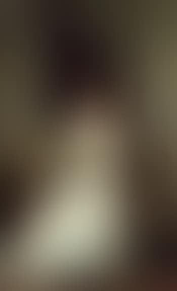 A portrait of Mrs. Mabel Brooks of Kinmount, in a cream dress, holding a plume of feathers (preview)