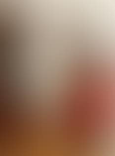 Portrait of Henny Brodersen seated on a sofa armrest (preview)