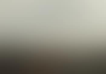 View Of A Rocky Shore With A Sailboat (preview)