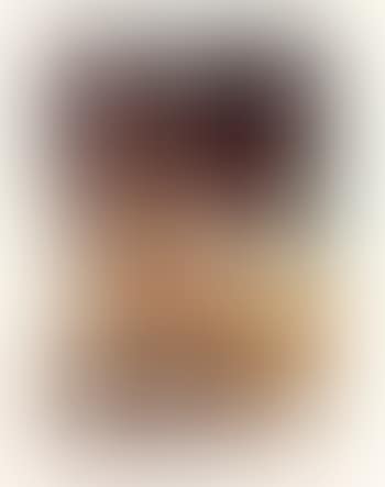 Untitled (Seated Man In Yellow Coveralls, Holding a Toy Snake) (preview)