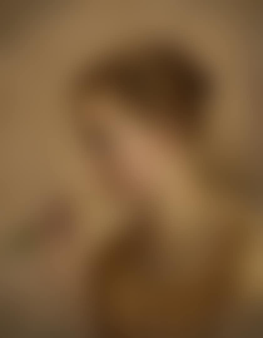 Young girl in profile breathing a rose (preview)