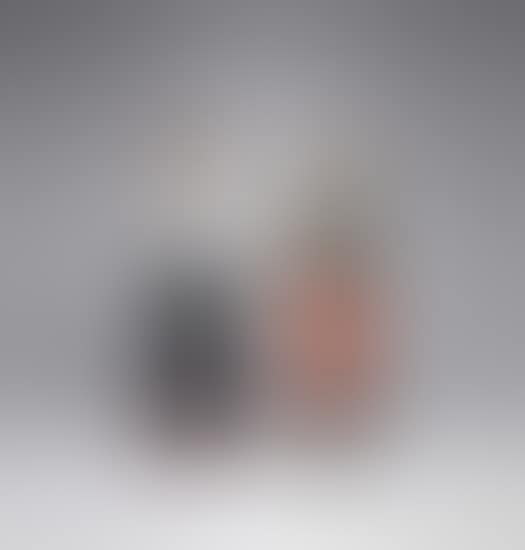 Man in White Shirt; and Woman in Orange Pants with Hand on Hip (preview)
