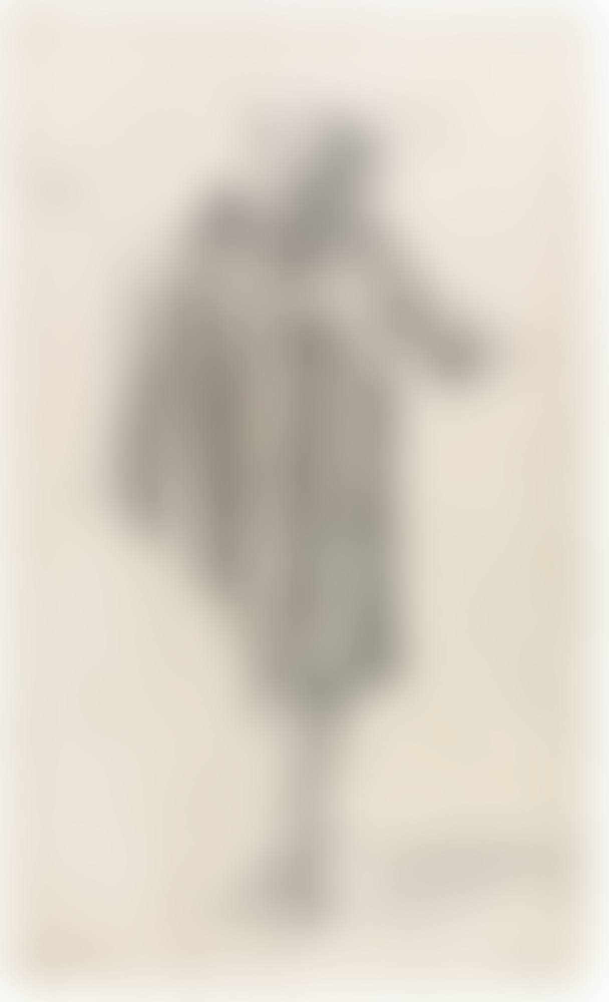 A STANDING MAN WEARING A CAPE AND HAT, SEEN FROM THE SIDE (preview)