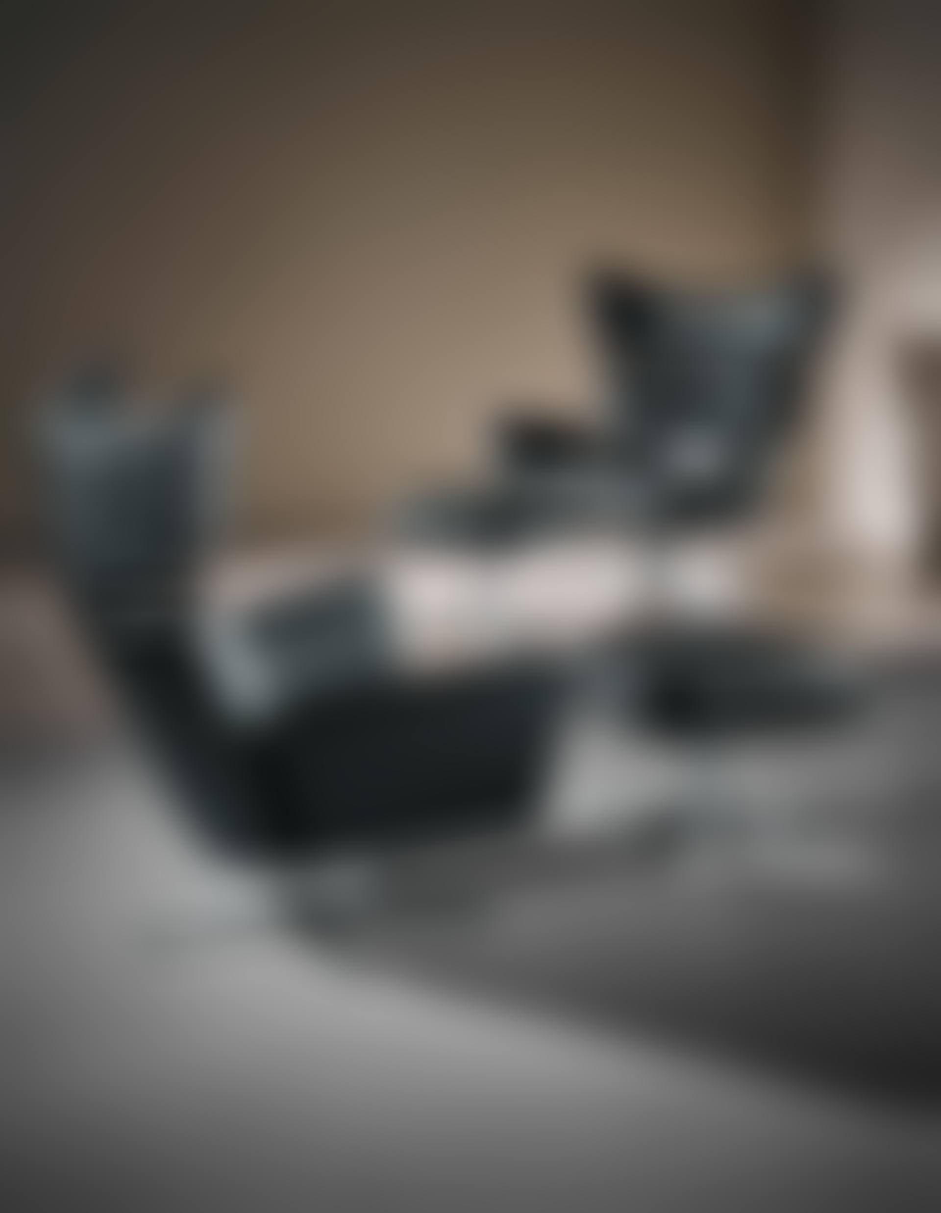 Pair of 'Ox' armchairs and ottomans (preview)