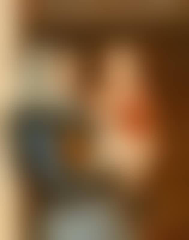 A woman from Skagen standing in the doorway holding her child (preview)