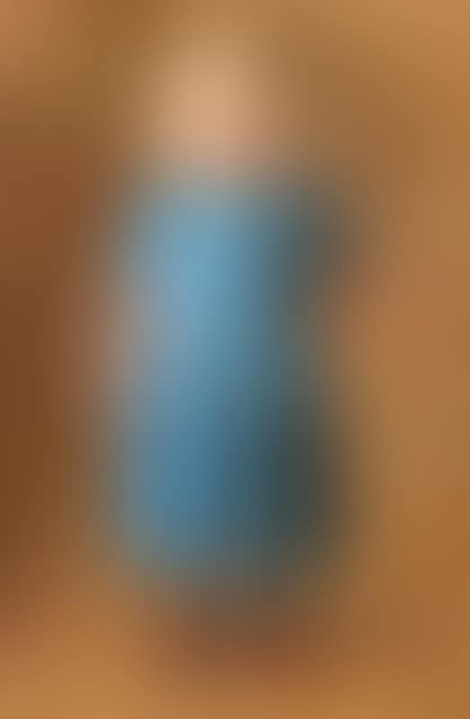 A little fair-haired Skagen girl in a blue dress and red shoes (preview)