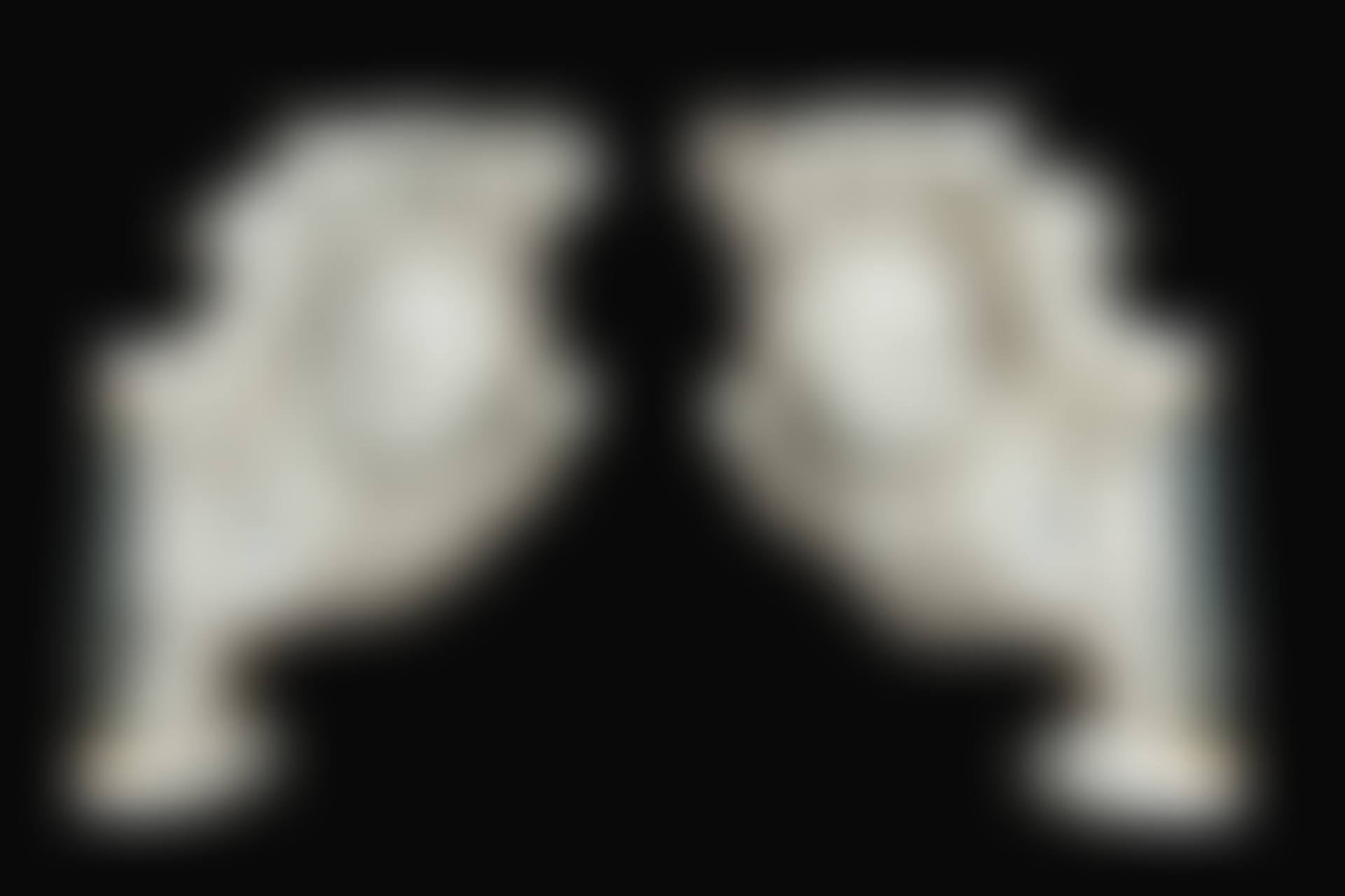 Pair of scrolls decorated with angel's heads (preview)