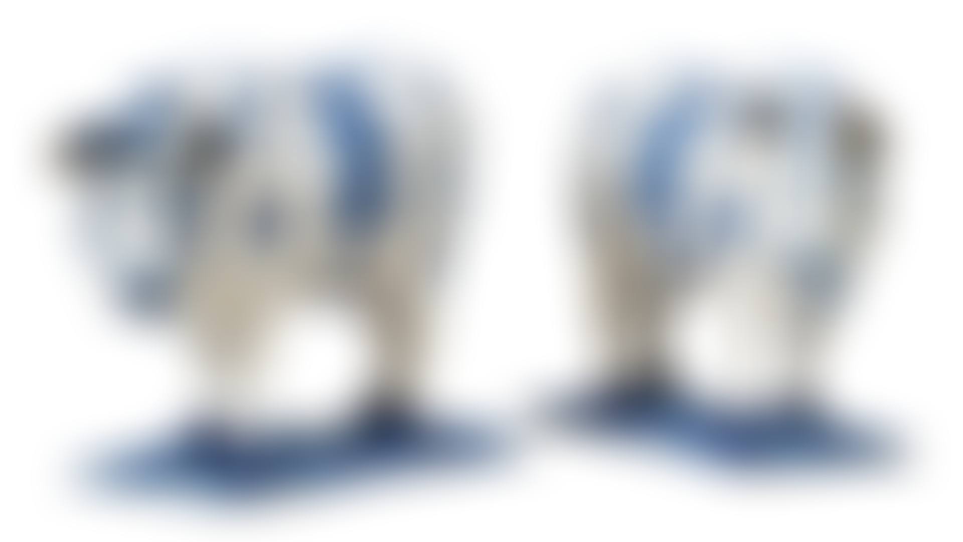 A PAIR OF DUTCH DELFT BLUE AND WHITE MODELS OF STANDING COWS (preview)