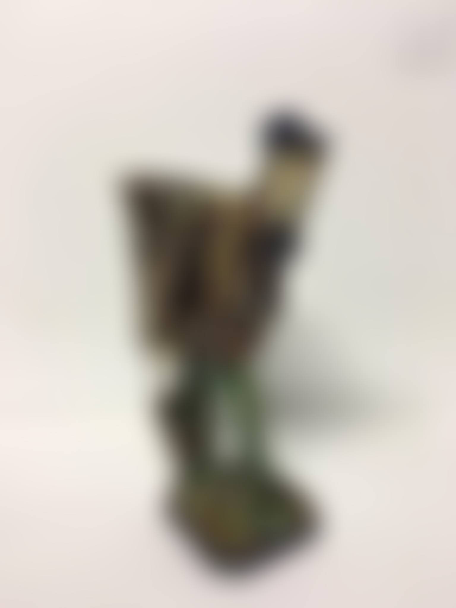 Polychrome enameled ceramic subject depicting a young man with a basket (preview)