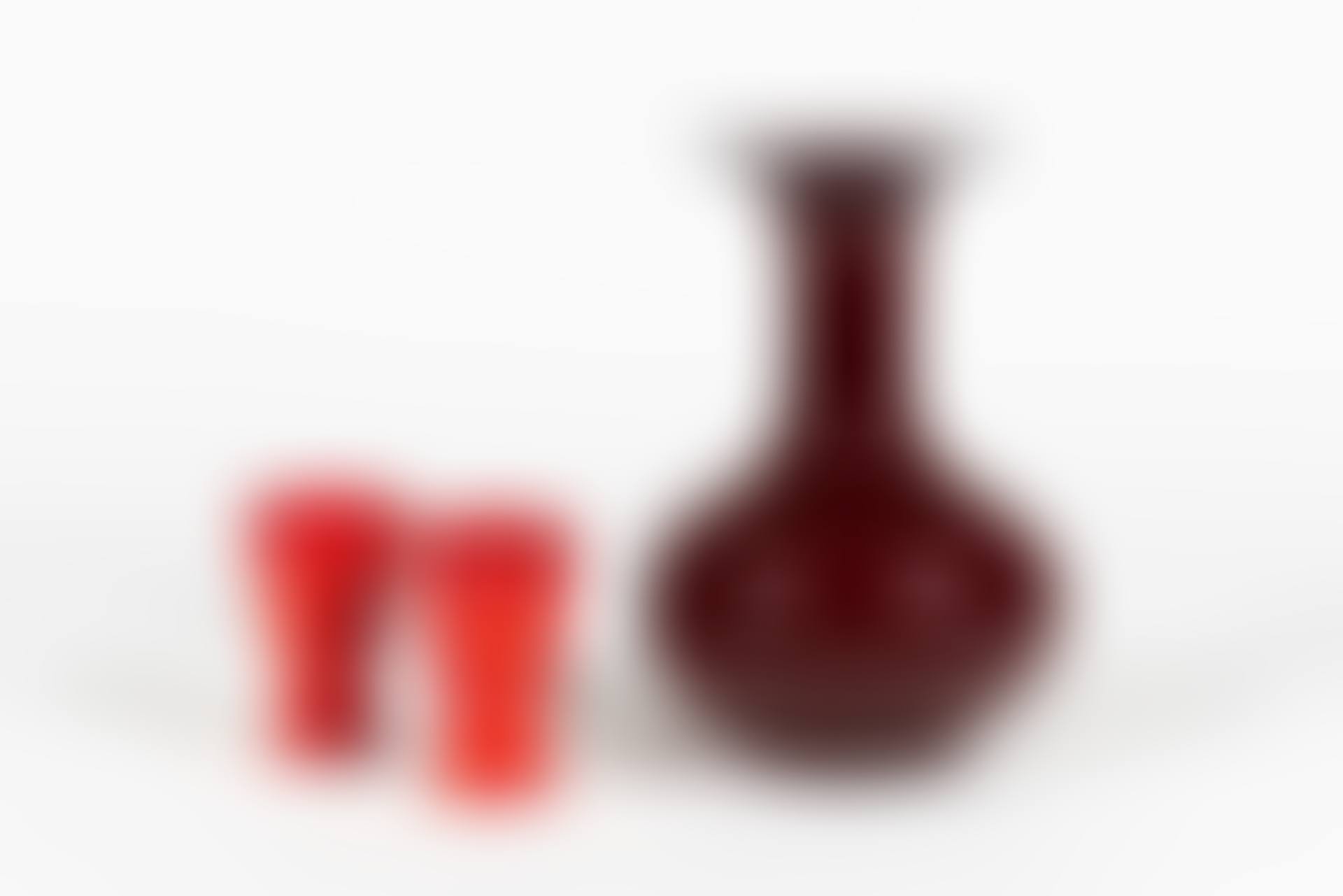 Paire de gobelets en céramique émaillées rouge; A pair of red glazed ceramic tumblers. A large red enamelled ceramic vase (preview)
