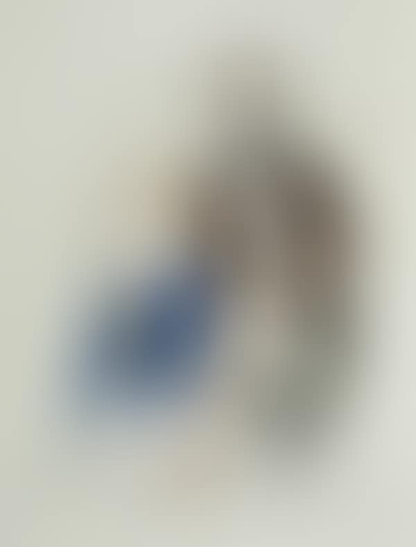 A man seated and another leaning on the chair (preview)