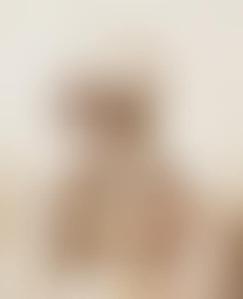 Head and shoulders portrait of a young woman with a bonnet (preview)