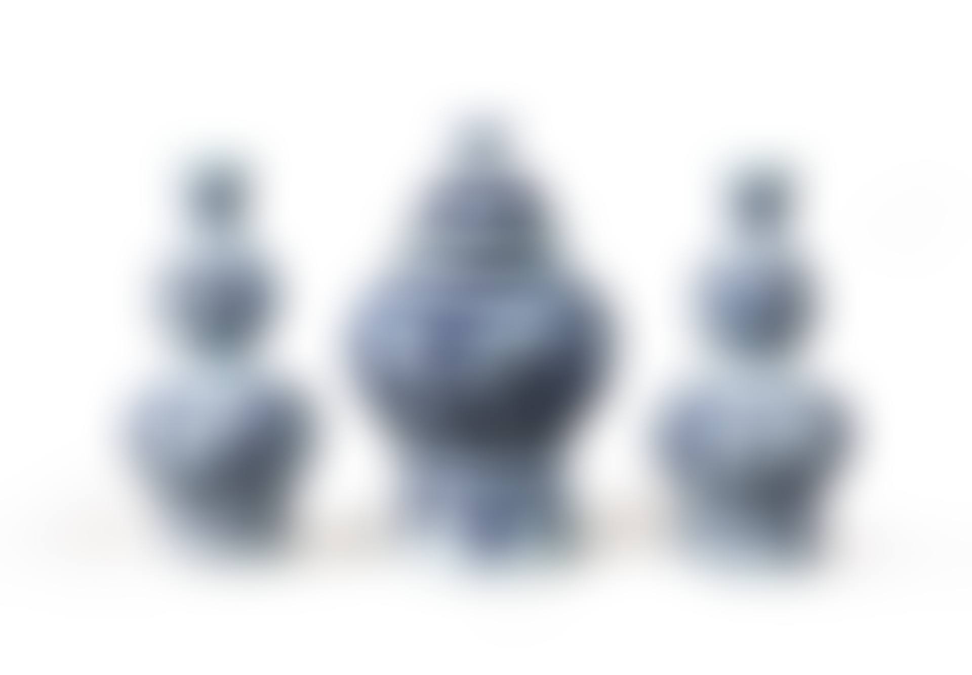 A pair of Dutch Delft blue and white chinoiserie onion-necked vases and a baluster vase and cover (preview)