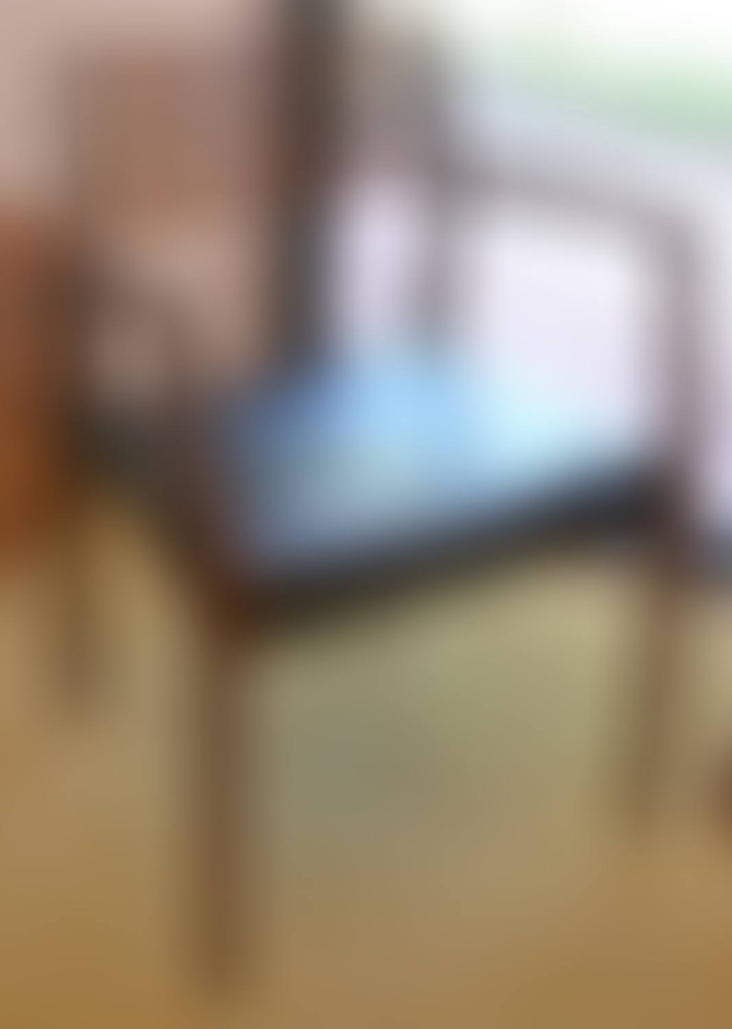 A DANISH ROSEWOOD FRAMED ARMCHAIR WITH A SLATTED BACK (preview)