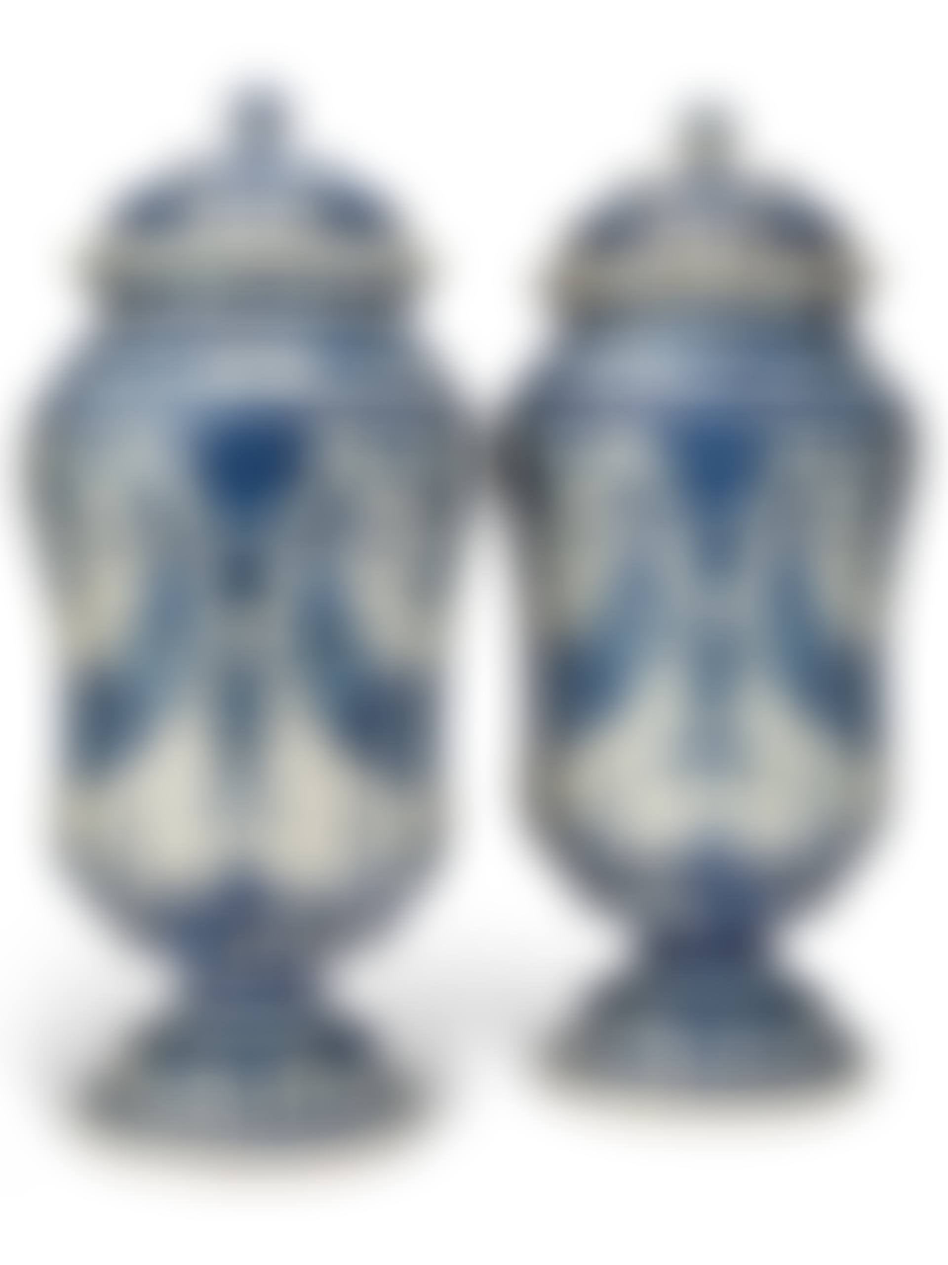 A LARGE PAIR OF FRENCH FAIENCE BLUE AND WHITE JARS AND COVERS (preview)