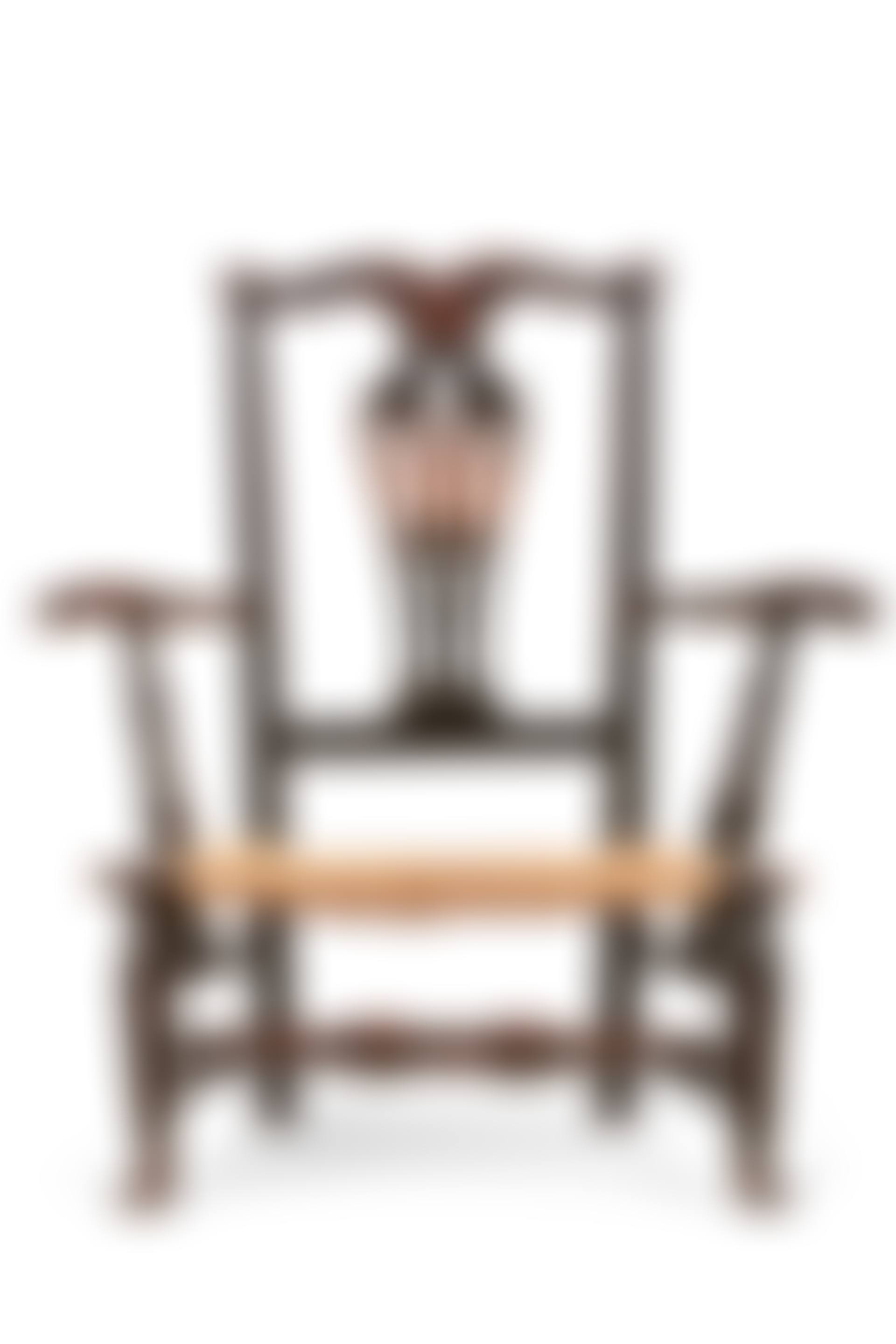 A CHIPPENDALE BLACK-PAINTED MAPLE SLIPPER ARMCHAIR (preview)