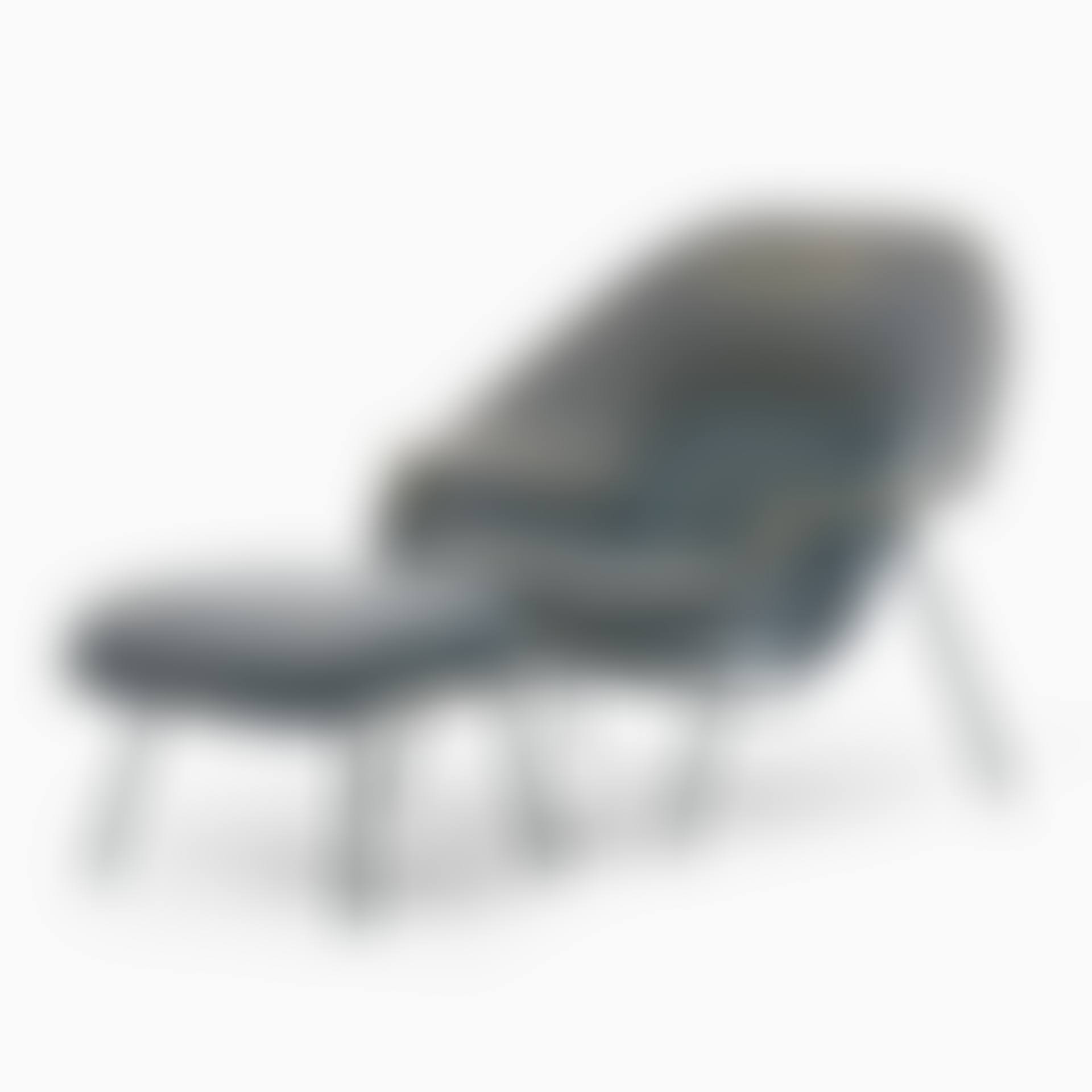 Armchair with footstool. "Womb chair"; An Eero Saarinen "Womb chair" with foot stool (preview)