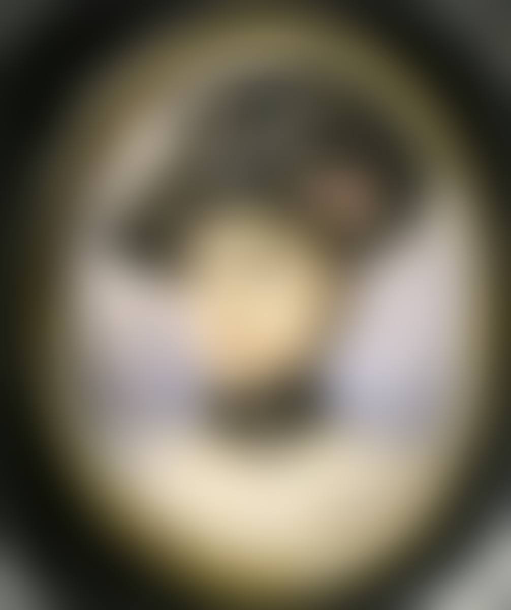 A lady, head and shoulders wearing a black hat (preview)