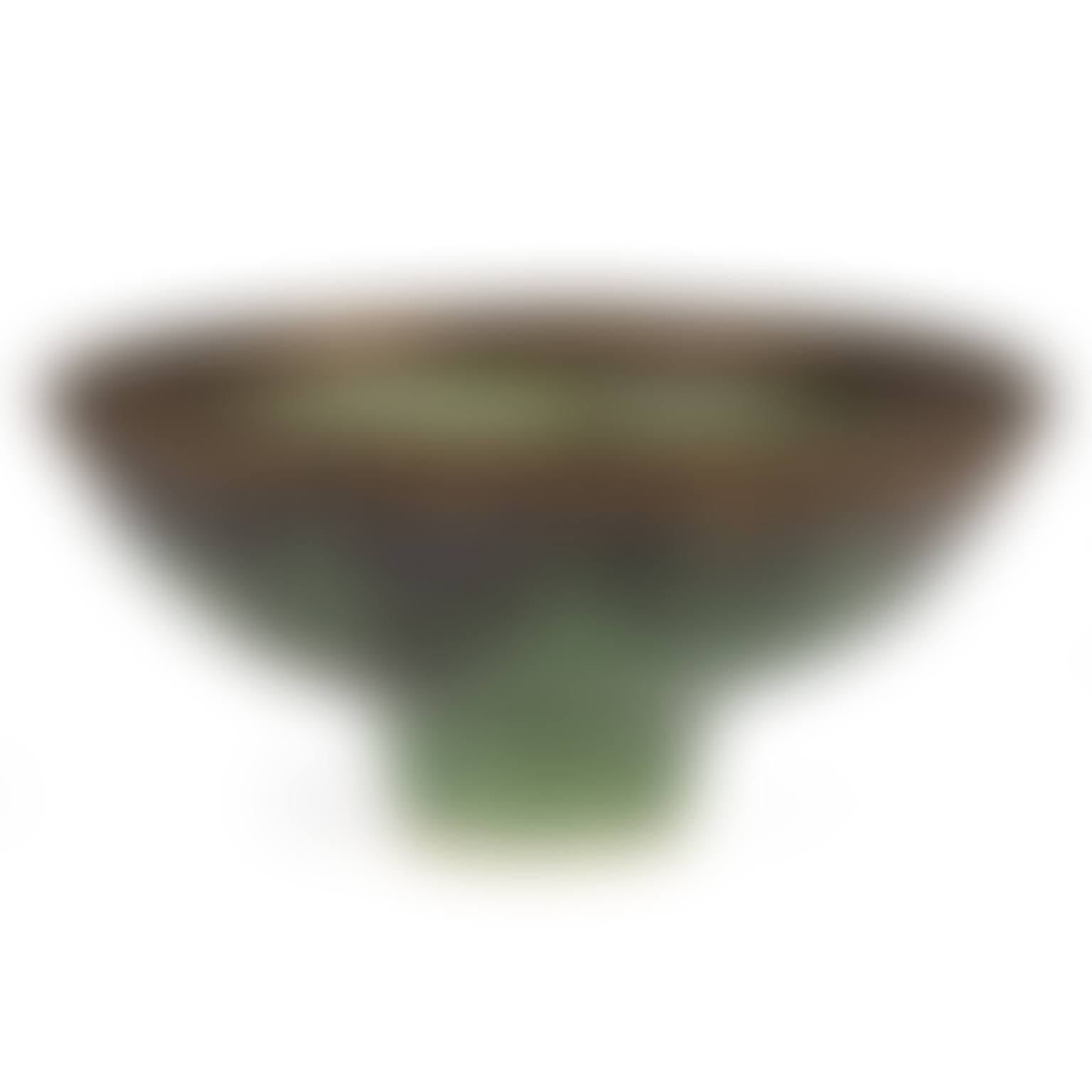 a stoneware footed bowl with an emerald green glaze and bronzed manganese drip rim (preview)