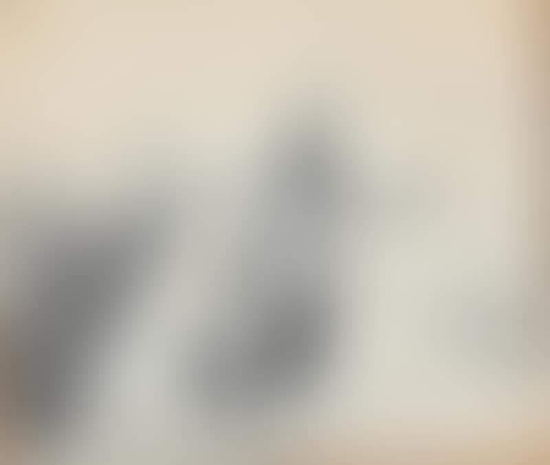 A fisherman and a woman on the beach with boats pulled up (preview)