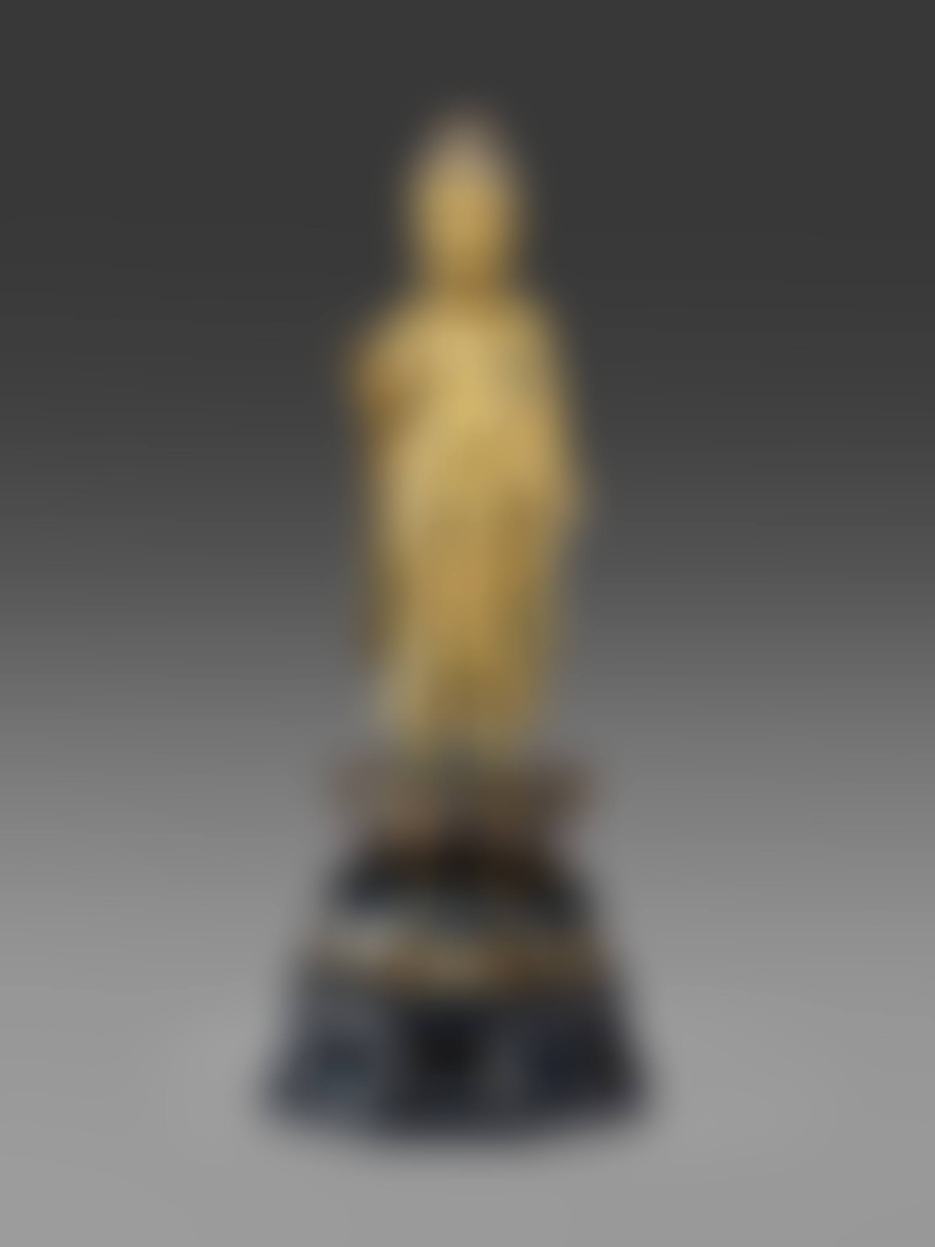 A GILT-BRONZE SCULPTURE OF A STANDING BUDDHA (preview)