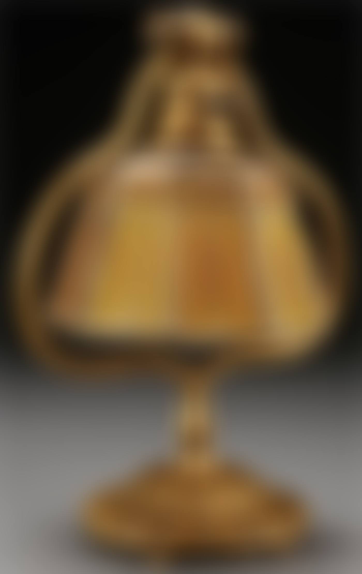 A TIFFANY STUDIOS ETCHED DORE BRONZE AND FAVRILE GLASS “LINEN FOLD” PIANO LAMP (preview)