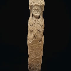 "A LIMESTONE TERM FIGURE, POSSIBLY DEPICTING BACCHUS"