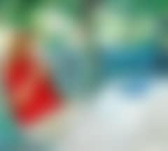 A little girl in red blouse crocheting in the garden (preview)