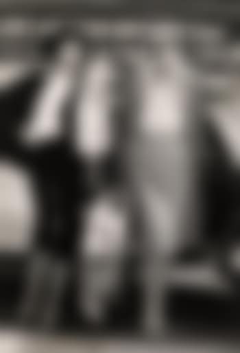 Models with newspaper and carphone (preview)
