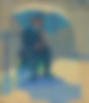 Seated man beneath umbrella (preview)