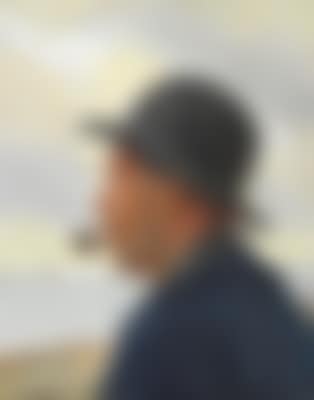 A man smoking a pipe at Skagen beach (preview)