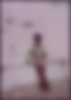 Man in a fisherman's smock leaning on the railings at Newlyn (preview)