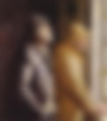 Two fishermen wearing oil skins looking out of window (preview)