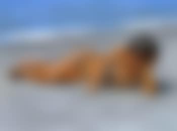 Nude boy lying on beach (preview)