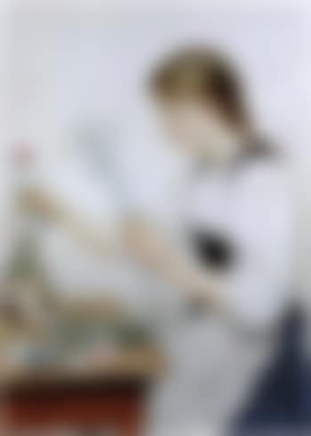 Girl putting flowers in vase (preview)