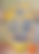 Yellow flowers in a pot and an orange on a ledge (preview)