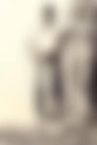 Man standing with arm on rock (preview)