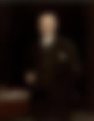 Portrait of H J Mitchell beside a desk (preview)