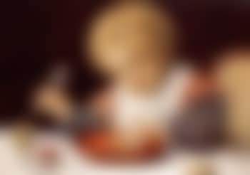 Kind am Tisch - Child seated at a table (preview)