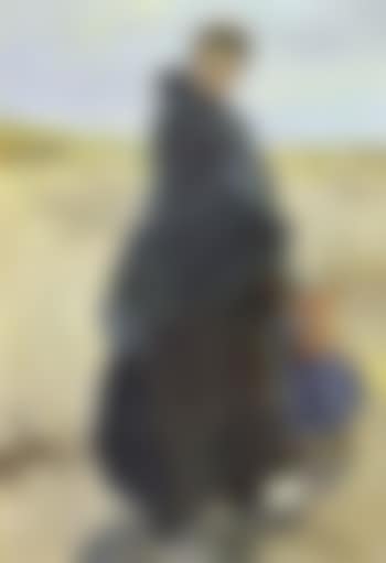 Fisherwoman with daughter on Dutch beach (preview)