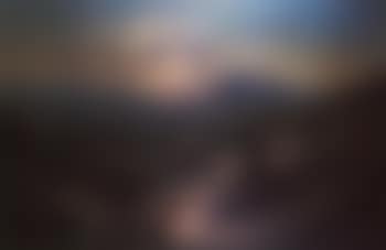 Extensive landscape with figure driving donkeys up a steep path (preview)
