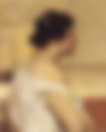 Profile portrait of woman wearing white blouse (preview)